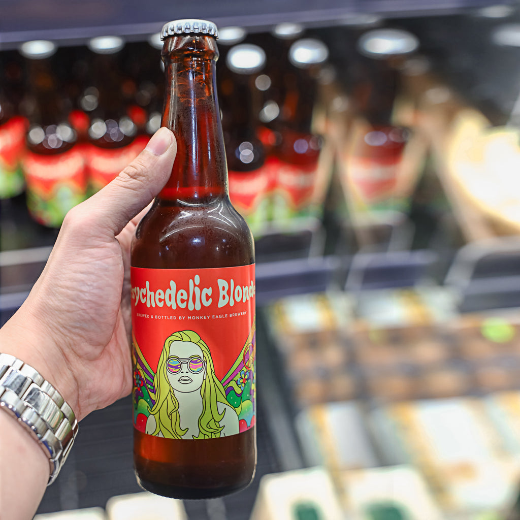 A bottle of Monkey Eagle Beer Psychedelic Blonde 330ml ice cold