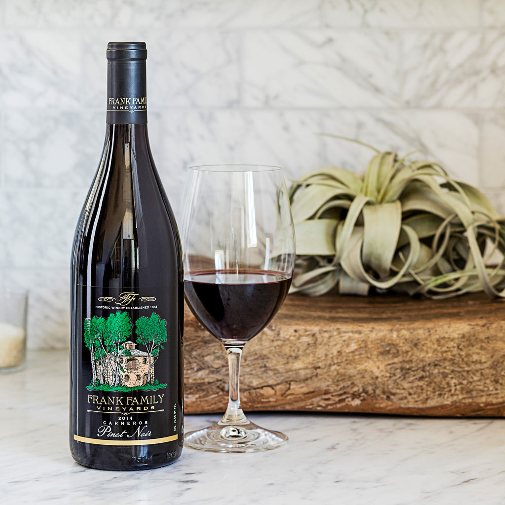 A bottle of Frank Family Carneros Pinot Noir 2018 in 750ml with glasses