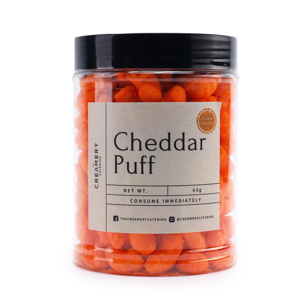 A pack of The Creamery Catering Cheddar Puffs